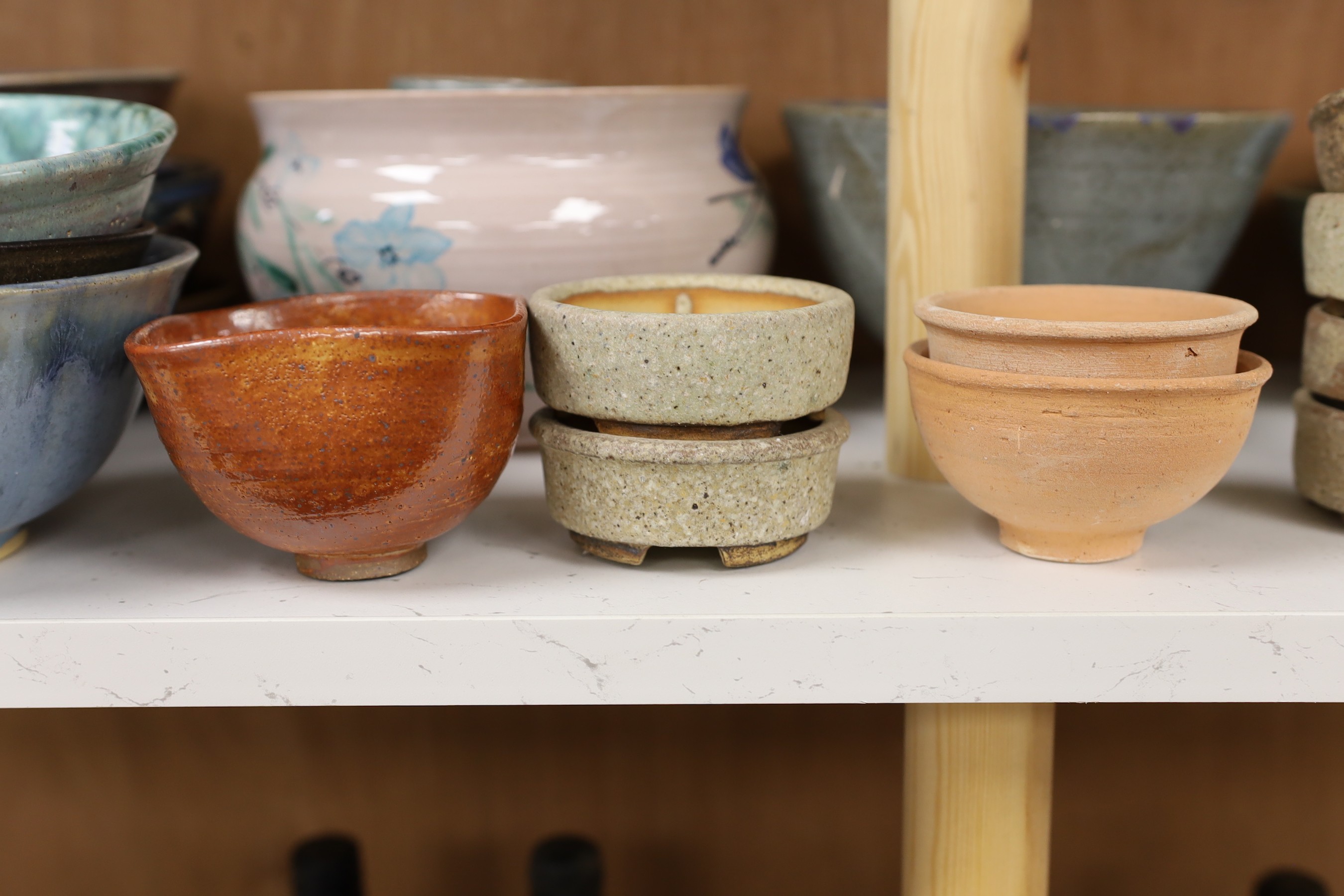 A large quantity of British studio pottery bowls and dishes, to include a vast amount by Susan Threadgold